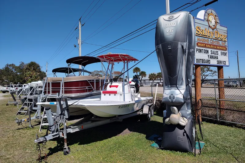 Slide: The Image of Boats displayed at Salty Dog Marine Center, featuring a 2016 Fat Cat 21 model. - 15