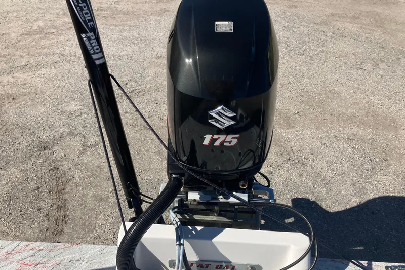Slide: The Image of Outboard motor on 2016 Fat Cat 21 boat, featuring Suzuki 175 engine. - 6