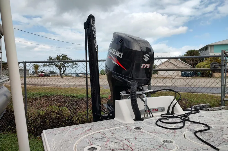 Slide: The Image of Outboard motor on 2016 Fat Cat 21 boat, featuring Suzuki 175 engine. - 7