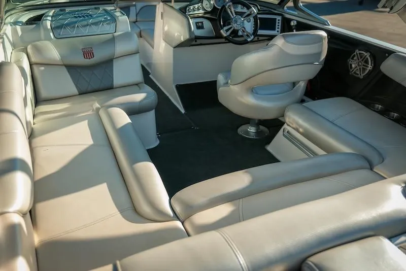 Slide: The Image of 2013 MasterCraft X-2 boat interior with luxurious seating and modern dashboard. - 13