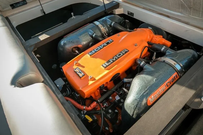 Slide: The Image of 2013 MasterCraft X-2 boat engine, featuring an orange Ilmor cover. - 22