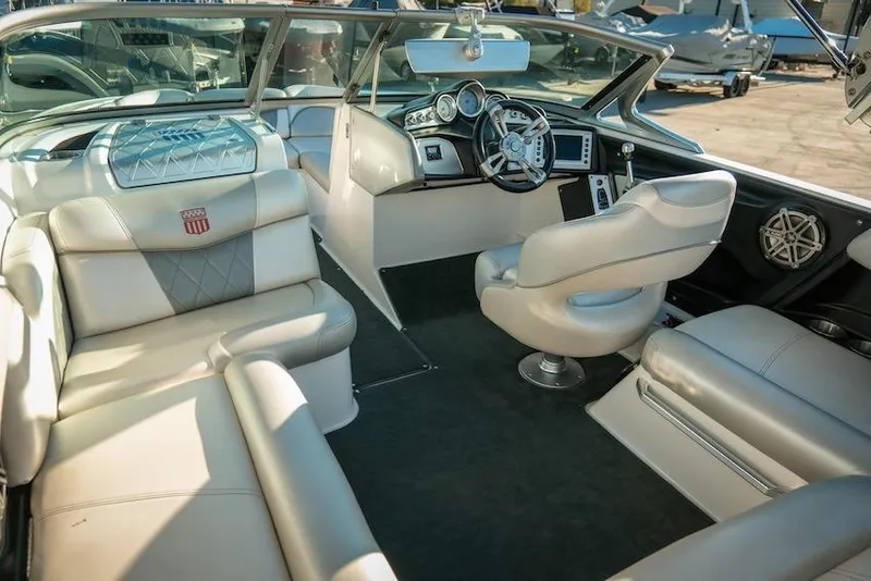 Slide: The Image of 2013 MasterCraft X-2 boat interior with luxurious seating and modern dashboard. - 23