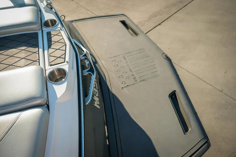 Slide: The Image of 2013 MasterCraft X-2 boat interior with cup holders and swim platform. - 3