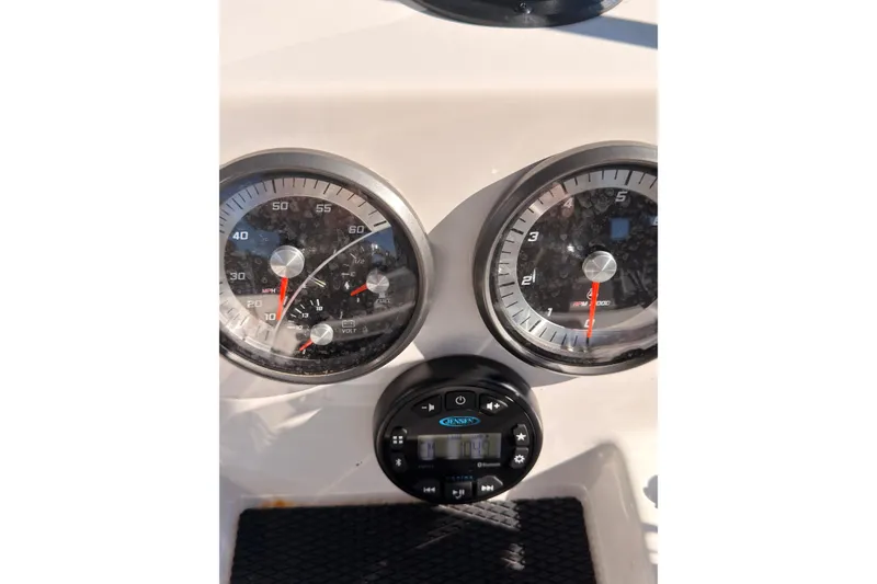 Slide: The Image of Dashboard of 2023 Trophy T-18 boat with speedometer and tachometer gauges. - 13