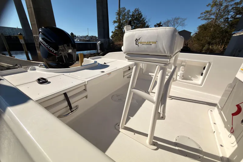 Slide: The Image of 2023 Trophy T-18 boat interior with Fishmaster seat and Mercury engine. - 14