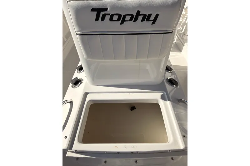 Slide: The Image of 2023 Trophy T-18 boat seat with storage compartment and cup holders. - 17