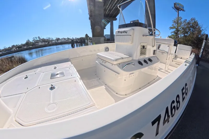 Slide: The Image of 2023 Trophy T-18 boat docked under a bridge on a sunny day. - 5