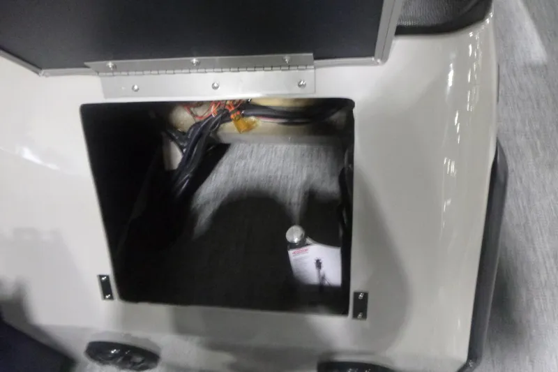 Slide: The Image of Open compartment of 2026 Premier 210 SunSation Angler 4 Point boat. - 10