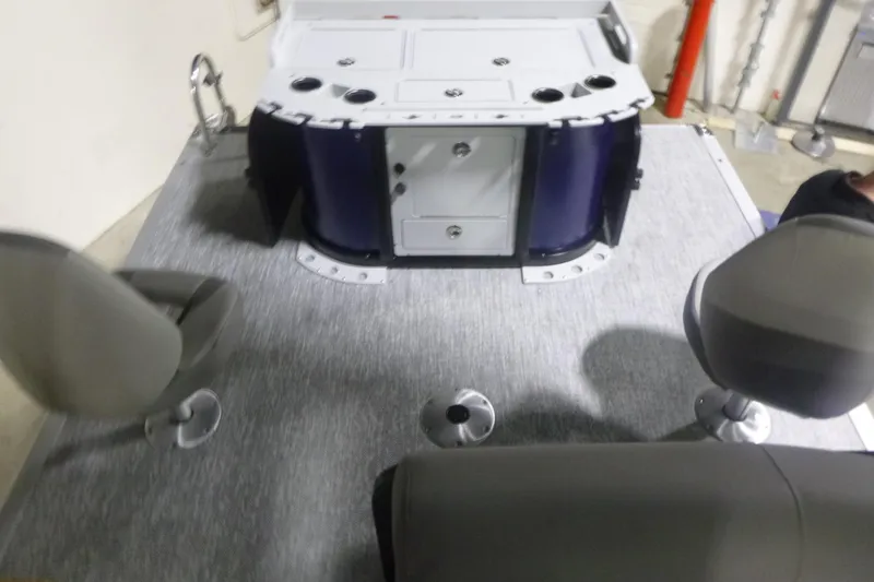 Slide: The Image of 2026 Premier 210 SunSation Angler 4 Point boat interior with seating and storage. - 15