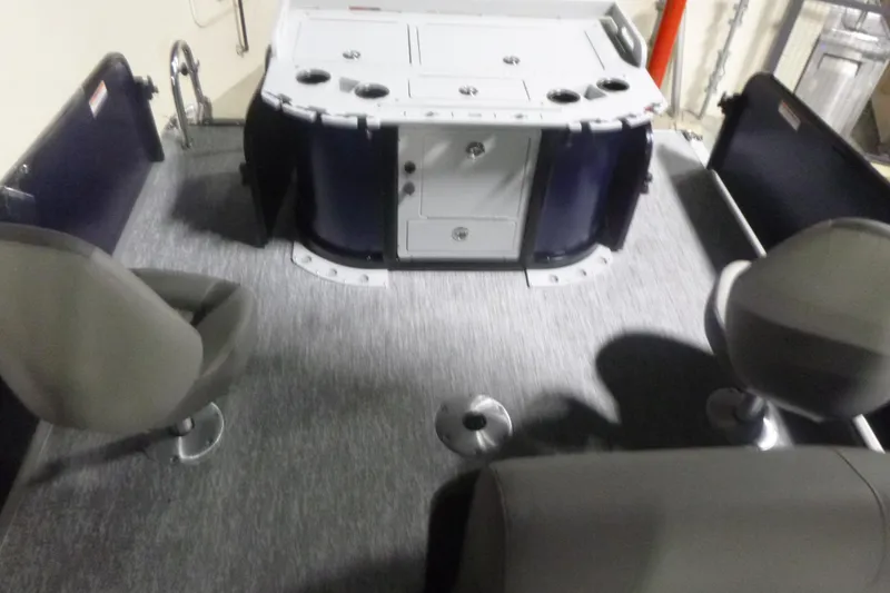Slide: The Image of 2026 Premier 210 SunSation Angler 4 Point interior with seating and storage compartments. - 16