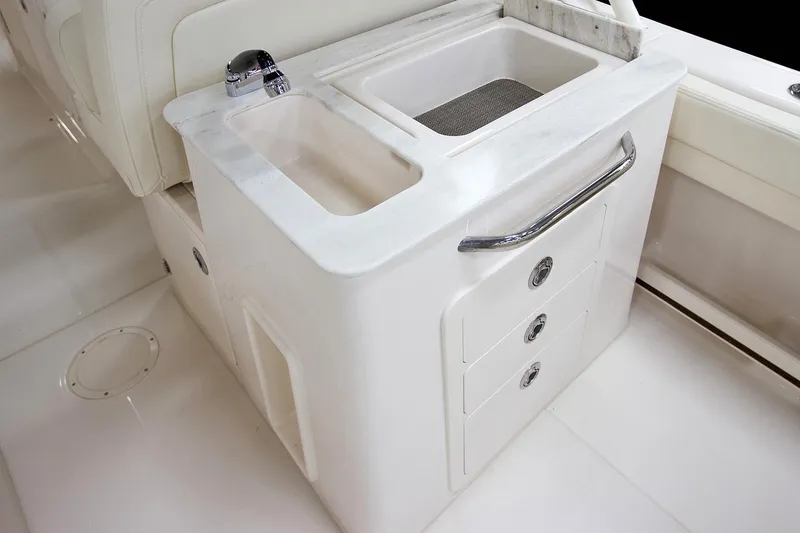 Slide: The Image of Manufacturer Provided Image: 2017 Grady-White Freedom 285 boat sink and storage area. - 14