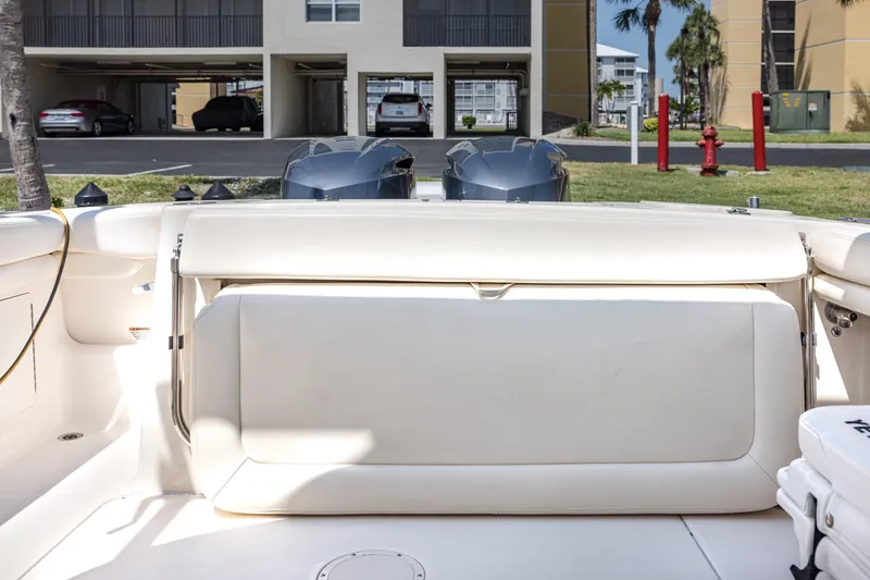 Slide: The Image of 2017 Grady-White Freedom 285 boat interior with seating and dual outboard motors. - 18