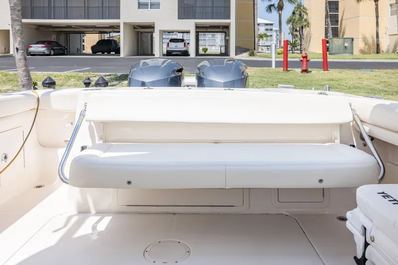 Slide: The Image of 2017 Grady-White Freedom 285 boat interior with seating and dual engines. - 19