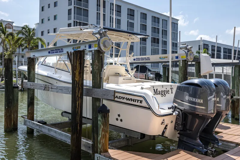 Slide: The Image of 2017 Grady-White Freedom 285 boat docked with dual Yamaha engines. - 2