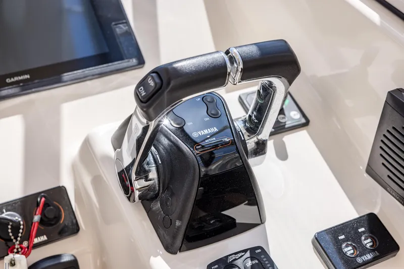 Slide: The Image of Close-up of 2017 Grady-White Freedom 285 boat controls with Yamaha throttle. - 27