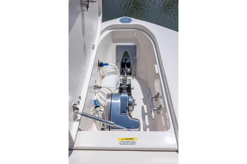 Slide: The Image of 2017 Grady-White Freedom 285 boat anchor compartment with winch and rope storage. - 38