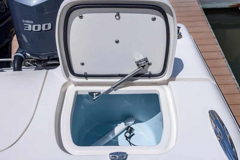 Slide: The Image of Open storage compartment on 2017 Grady-White Freedom 285 boat, with Yamaha 300 engine visible. - 41