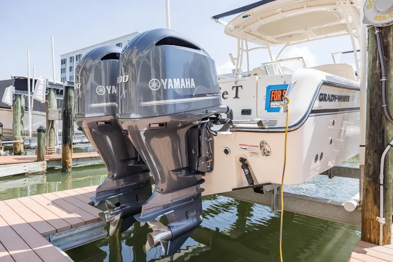 Slide: The Image of 2017 Grady-White Freedom 285 boat with twin Yamaha 300 engines docked for sale. - 5