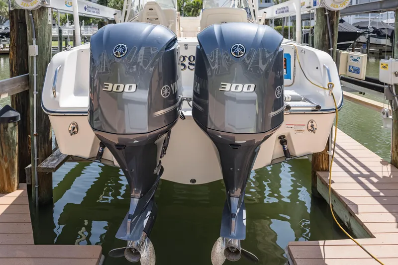 Slide: The Image of 2017 Grady-White Freedom 285 boat with twin Yamaha 300 engines docked at marina. - 7