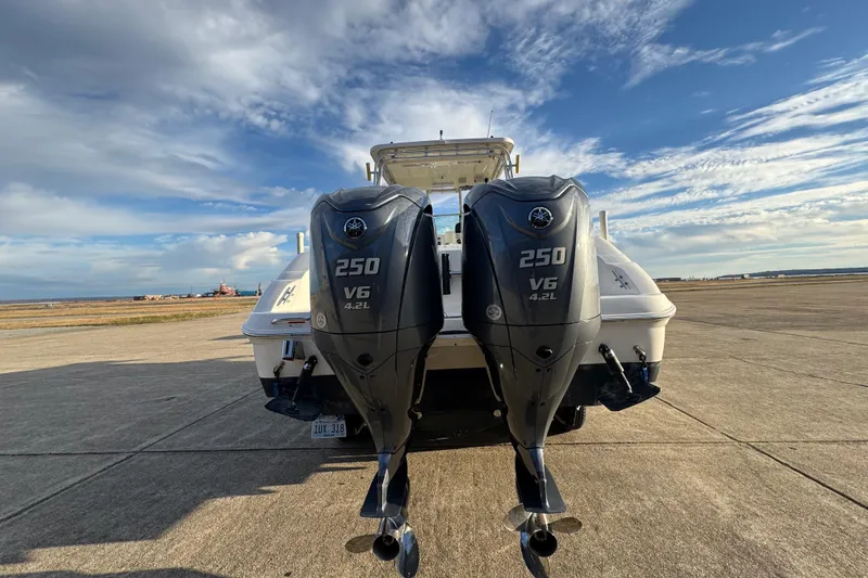 Slide: The Image of 2009 Wellcraft 270 Coastal O/B with twin 250 V6 outboard engines on a sunny day. - 10