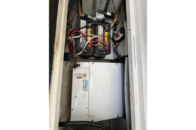 Slide: The Image of 2009 Wellcraft 270 Coastal O/B boat battery compartment with wiring and components. - 29