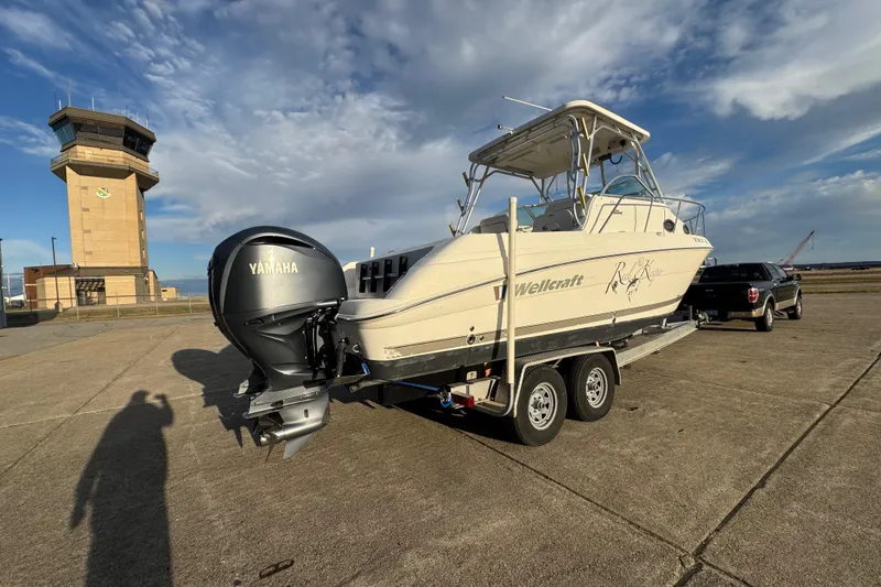 Slide: The Image of 2009 Wellcraft 270 Coastal O/B boat on trailer with Yamaha engine, near control tower. - 8