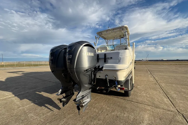 Slide: The Image of 2009 Wellcraft 270 Coastal O/B boat with dual Yamaha engines on a sunny day. - 9