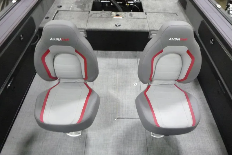 Slide: The Image of 2026 Alumacraft Trophy 205X Sport boat interior with two gray and red seats. - 13