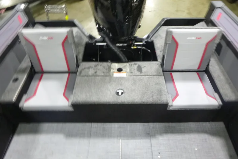 Slide: The Image of 2026 Alumacraft Trophy 205X Sport boat interior with gray and red seating. - 15