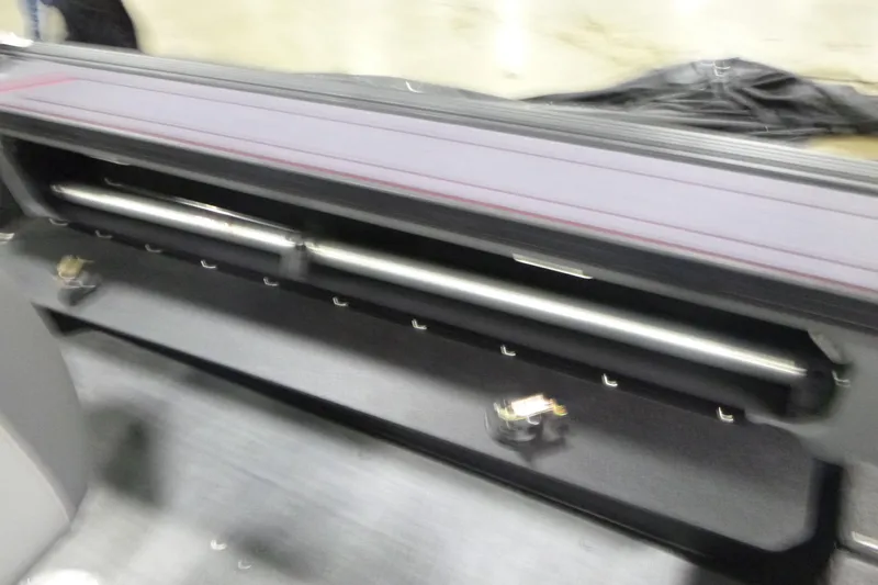 Slide: The Image of 2026 Alumacraft Trophy 205X Sport interior storage compartment detail. - 17