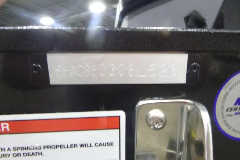 Slide: The Image of 2026 Alumacraft Trophy 205X Sport boat identification plate with warning label. - 20