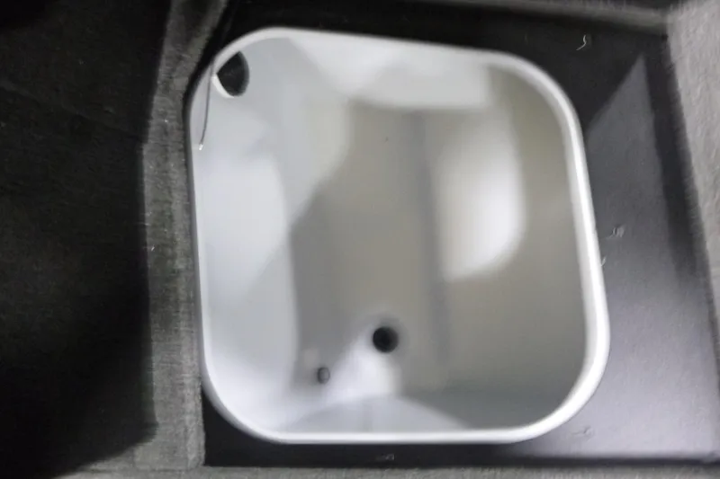 Slide: The Image of Livewell compartment in 2026 Alumacraft Trophy 205X Sport boat interior. - 7