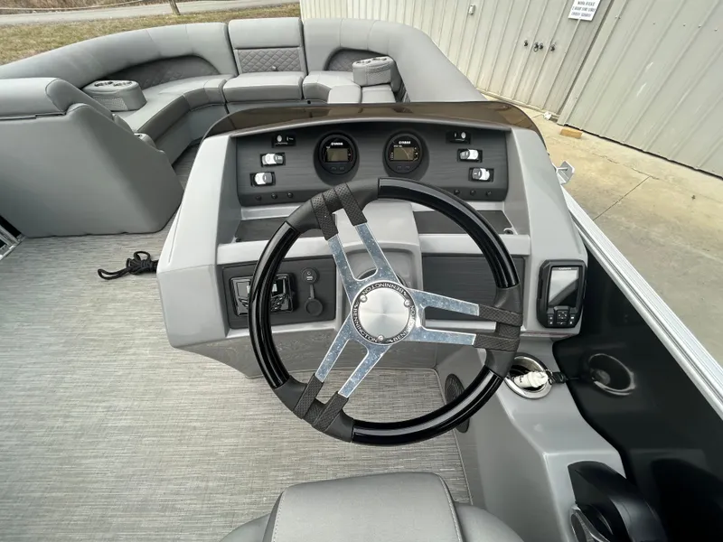 Slide: The Image of 2023 Bennington 23 LSB boat interior with steering wheel. - 4