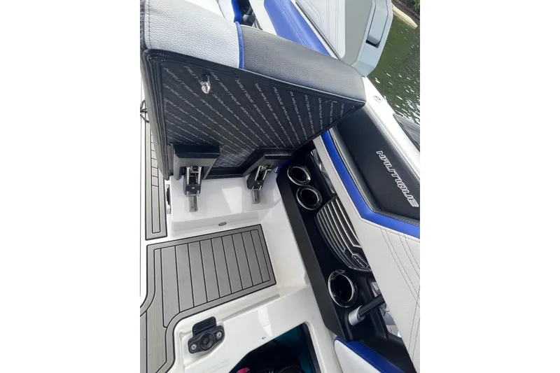 Slide: The Image of 2017 Nautique Super Air Nautique G25 interior with seating and cup holders. - 15