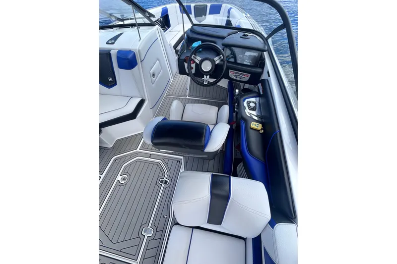 Slide: The Image of 2017 Nautique Super Air Nautique G25 boat interior with modern dashboard and seating. - 21