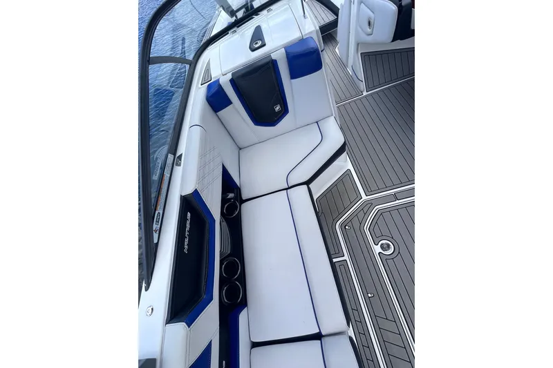 Slide: The Image of 2017 Nautique Super Air Nautique G25 interior with blue and white seating. - 22