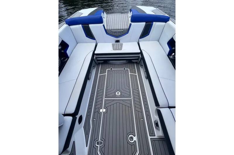 Slide: The Image of 2017 Nautique Super Air Nautique G25 interior with sleek seating and modern flooring design. - 24