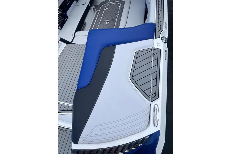 Slide: The Image of 2017 Nautique Super Air Nautique G25 boat interior with blue and gray seating. - 27