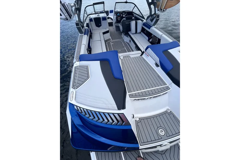 Slide: The Image of 2017 Nautique Super Air Nautique G25 interior with blue and gray seating on water. - 29