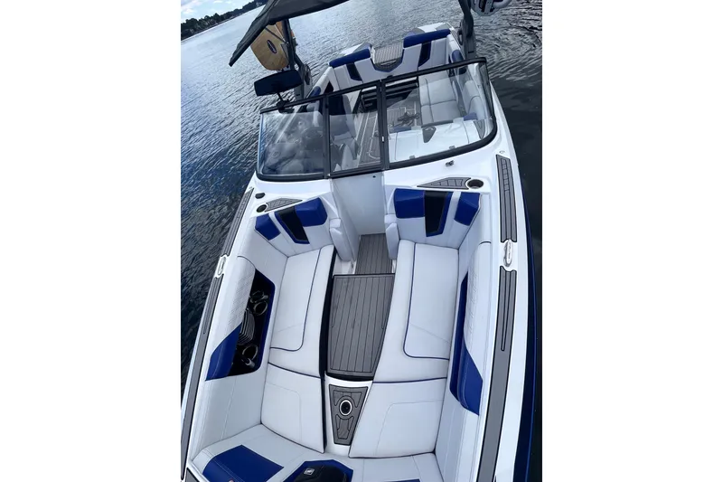 Slide: The Image of 2017 Nautique Super Air Nautique G25 boat with sleek interior design on water. - 32