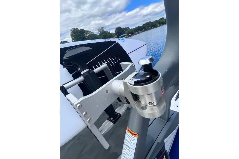 Slide: The Image of 2017 Nautique Super Air Nautique G25 boat detail with lake background. - 37