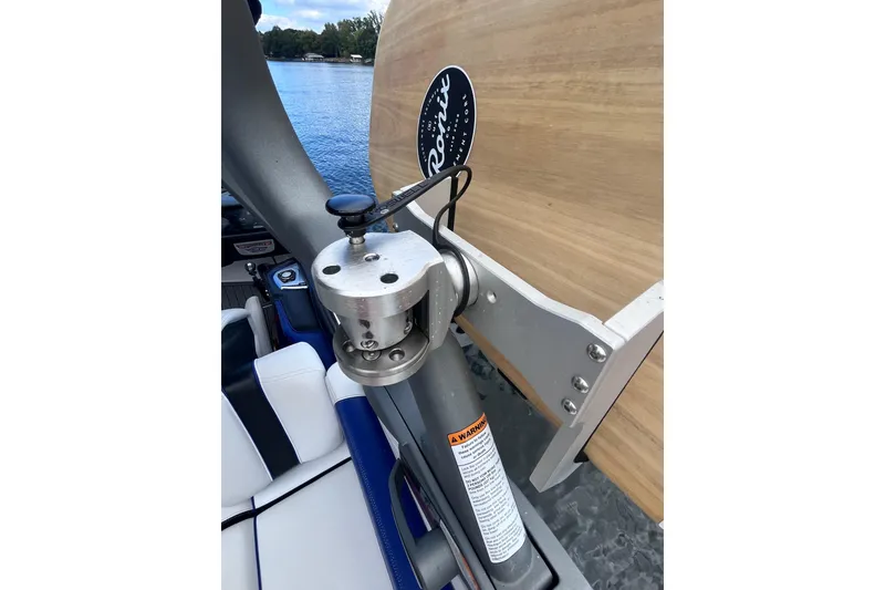 Slide: The Image of 2017 Nautique Super Air Nautique G25 boat interior with metal fixture and lake view. - 38