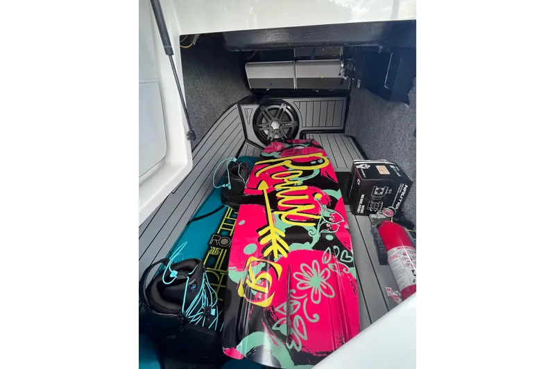 Slide: The Image of 2017 Nautique Super Air Nautique G25 storage with colorful wakeboard and equipment. - 40