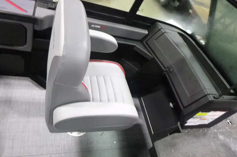 Slide: The Image of 2025 Alumacraft Trophy 205X Sport interior with gray and white seating. - 10