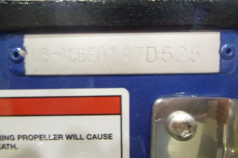 Slide: The Image of 2025 Alumacraft Trophy 205X Sport boat identification plate with warning label. - 18