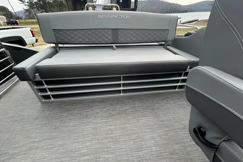 Slide: The Image of 2023 Bennington L 23 Swingback boat interior with gray seating and quilted backrest. - 10