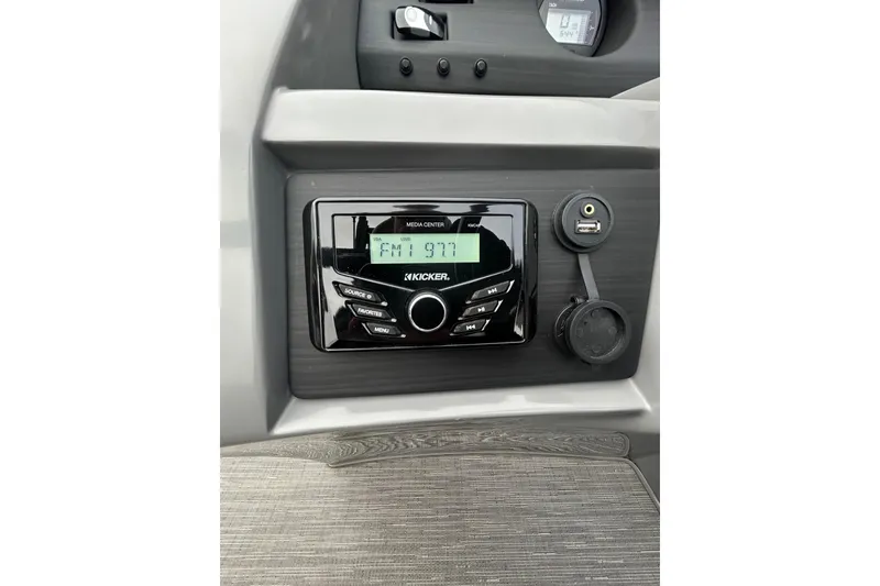 Slide: The Image of 2023 Bennington L 23 Swingback dashboard with Kicker media center and USB port. - 7