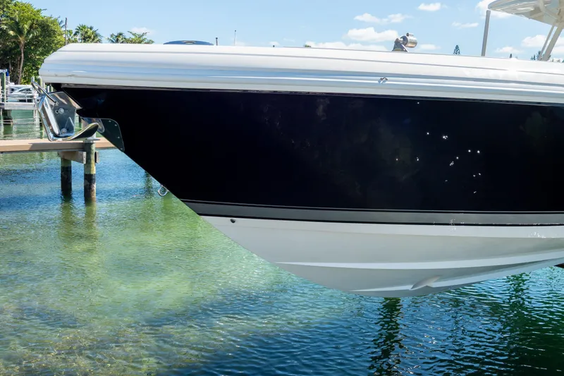 Slide: The Image of 2015 Intrepid 400 Center Console boat docked in clear water. - 116