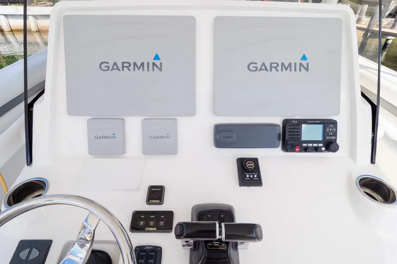 Slide: The Image of Control panel of 2015 Intrepid 400 Center Console with Garmin navigation displays. - 120