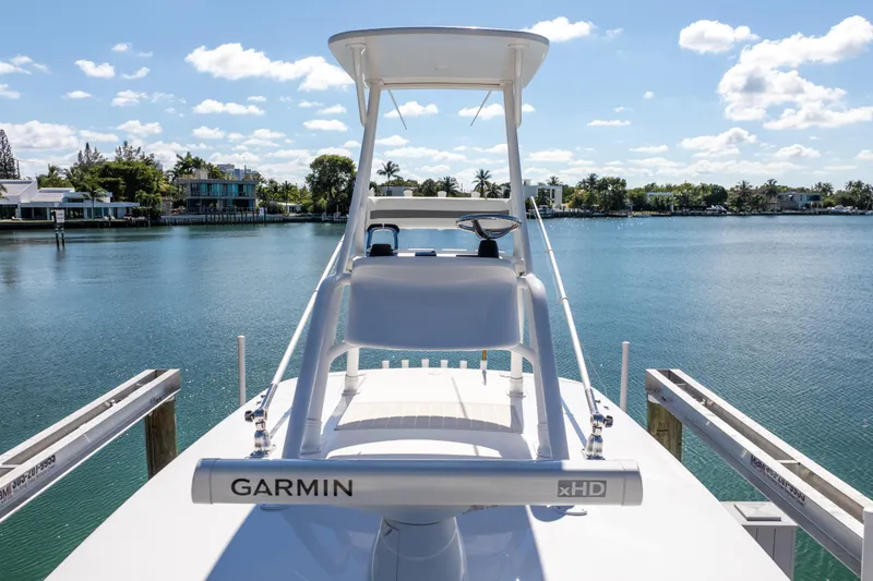 Slide: The Image of 2015 Intrepid 400 Center Console boat docked with Garmin radar, scenic waterfront view. - 13